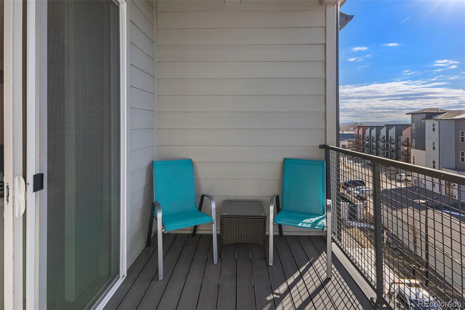 9287 Twenty Mile Road, Unit 401 Parker, CO 80134 - Photo 25 of 44 a view of a chairs in balcony