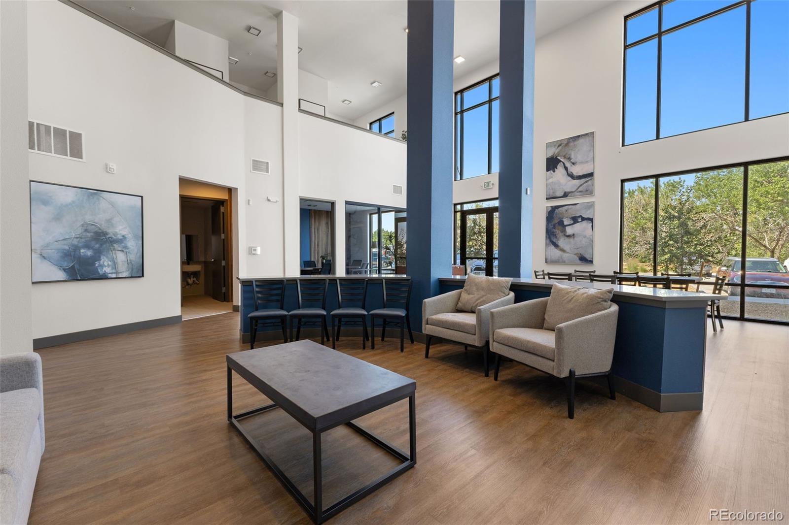 9287 Twenty Mile Road, Unit 401 Parker, CO 80134 - Photo 32 of 44 a living room with furniture and a large window