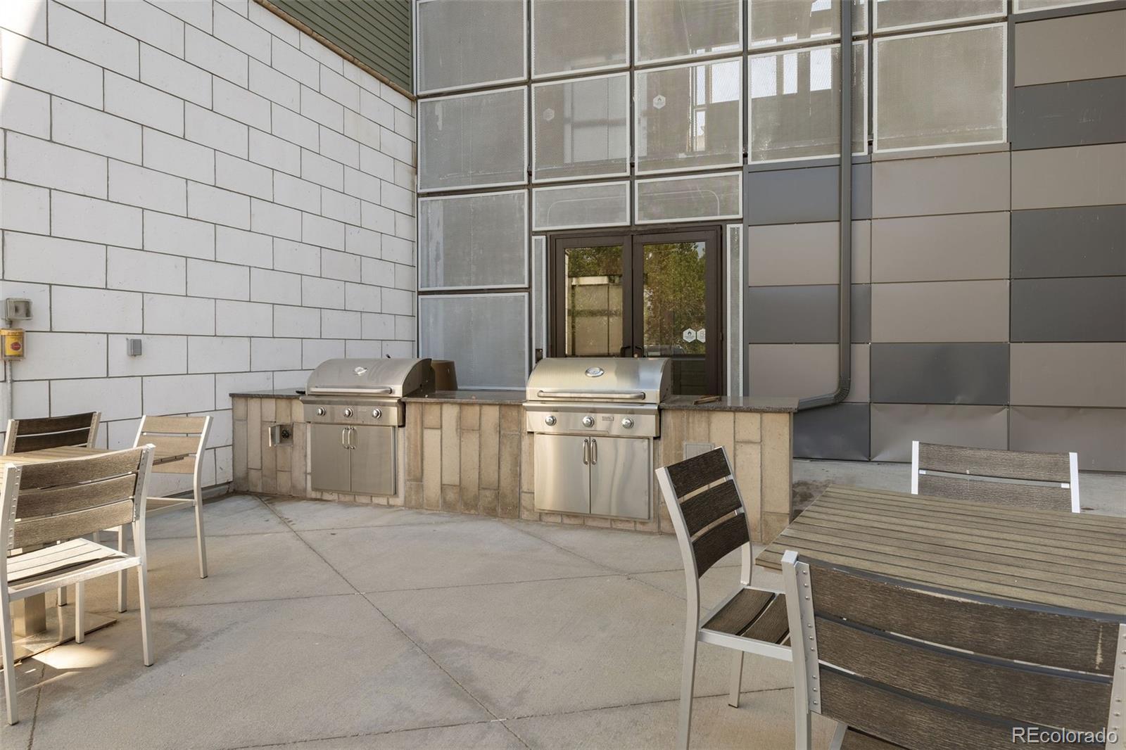 9287 Twenty Mile Road, Unit 401 Parker, CO 80134 - Photo 37 of 44 a bathroom with a sink and washing machine