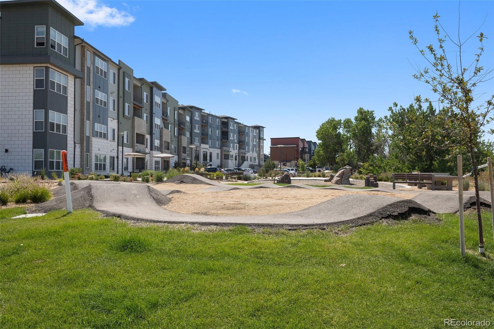 9287 Twenty Mile Road, Unit 401 Parker, CO 80134 - Photo 39 of 44 a swimming pool with view of tall buildings
