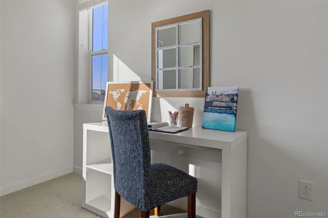 a balcony with table and chairs