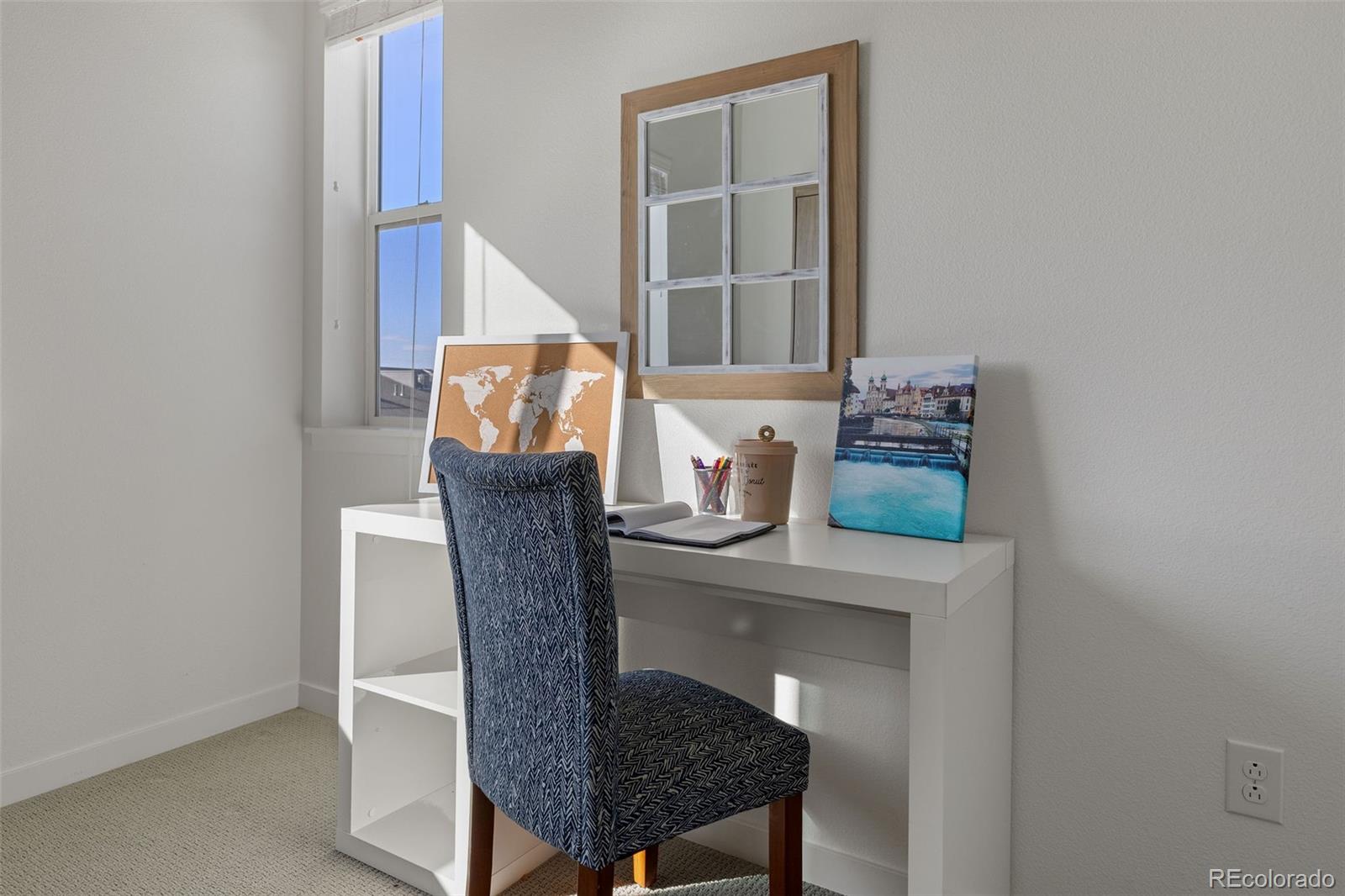 9287 Twenty Mile Road, Unit 401 Parker, CO 80134 - Photo 10 of 44 a balcony with table and chairs