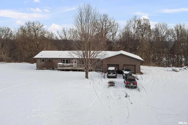 a view of a roof covered with snow in the background