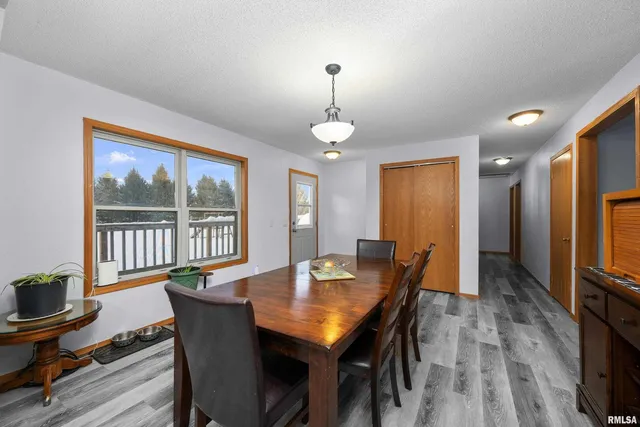 a kitchen with stainless steel appliances a sink dishwasher a stove top oven a refrigerator with island and cabinets