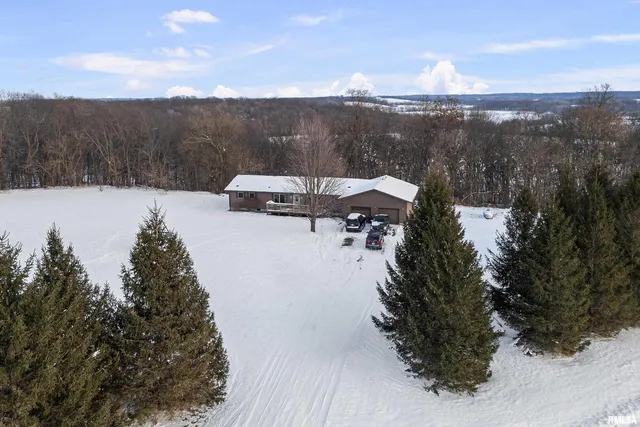 a view of a terrace with a garden and trees
