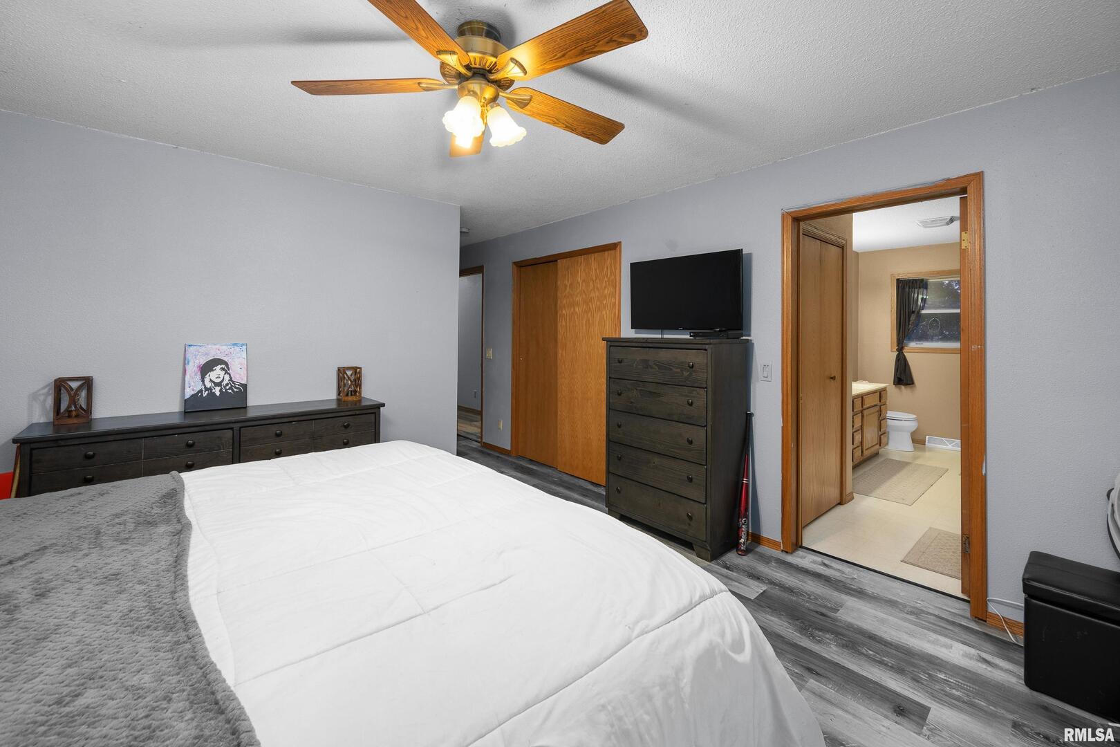 1231 90th Street Joy, IL 61260 - Photo 31 of 38 a bedroom with a bed and a flat screen tv