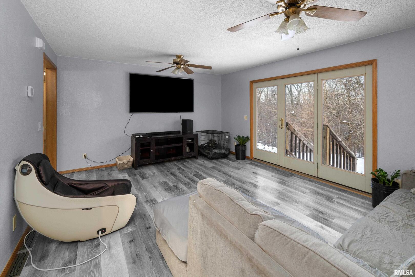 1231 90th Street Joy, IL 61260 - Photo 35 of 38 a living room with furniture and a flat screen tv