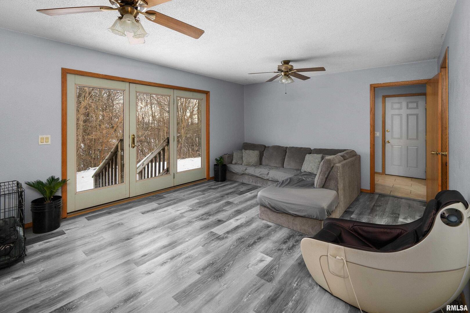 1231 90th Street Joy, IL 61260 - Photo 36 of 38 a living room with furniture and a floor to ceiling window