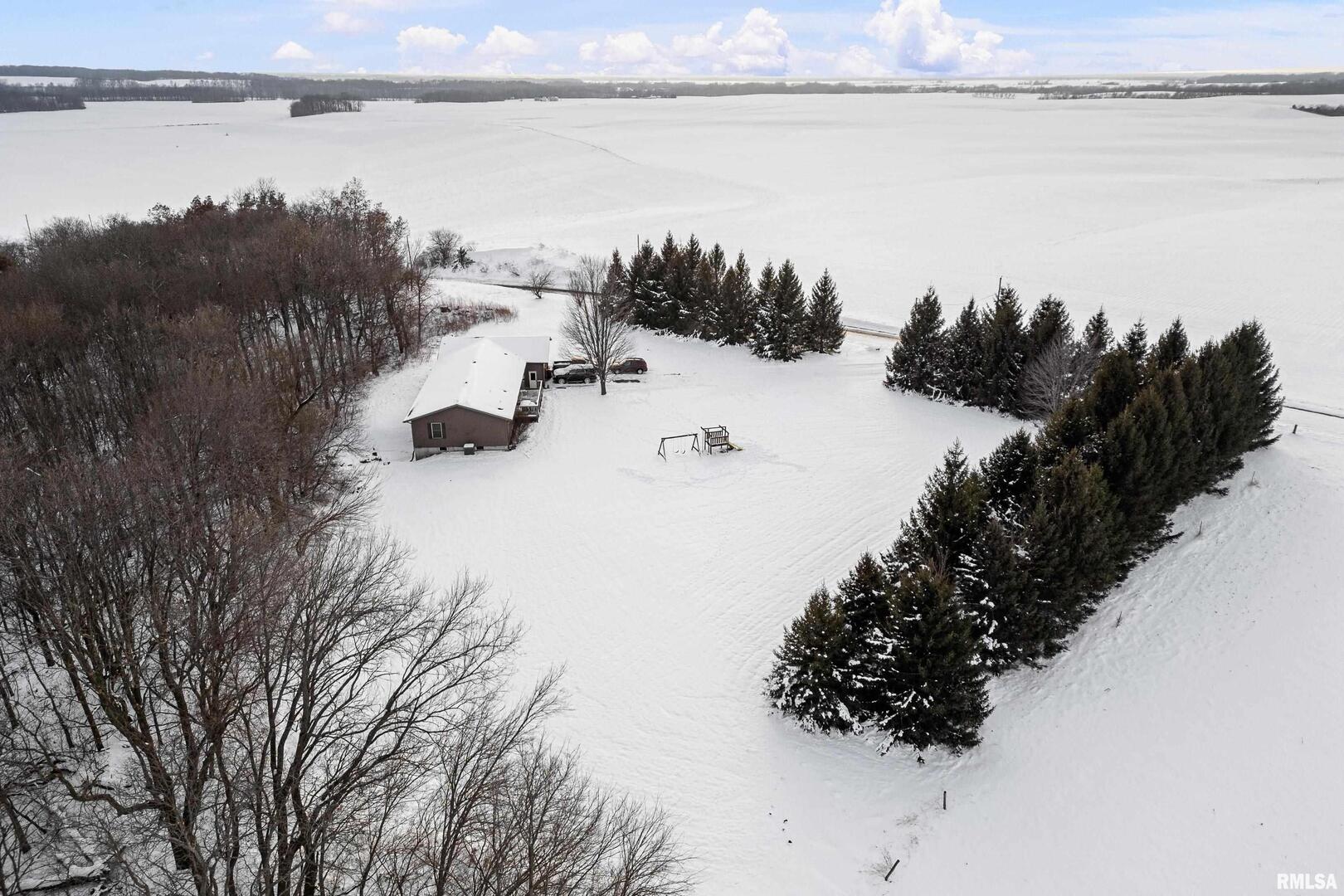 1231 90th Street Joy, IL 61260 - Photo 8 of 38 a view of a lake and mountain in the back