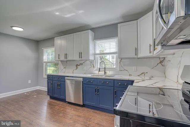 a view of an empty room and wooden floor
