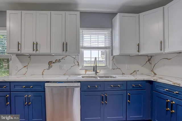 a bathroom with a sink toilet vanity and bathtub