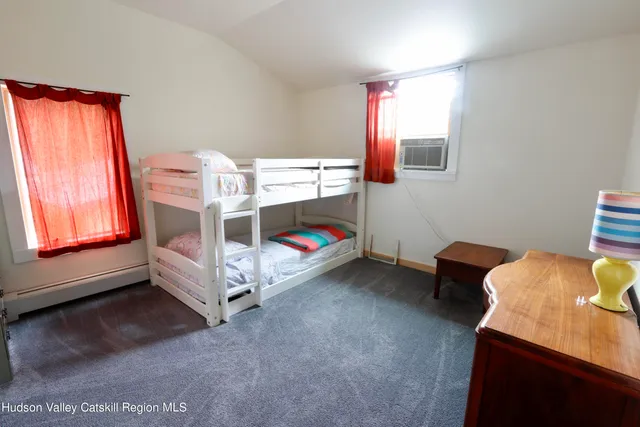 a bed room with a bed and a window