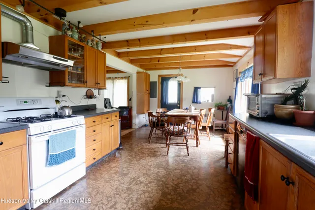 a kitchen with sink and cabinets