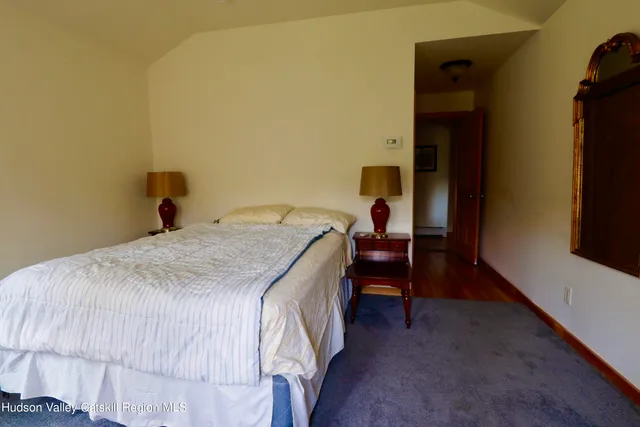 a bedroom with a bed and a table in it