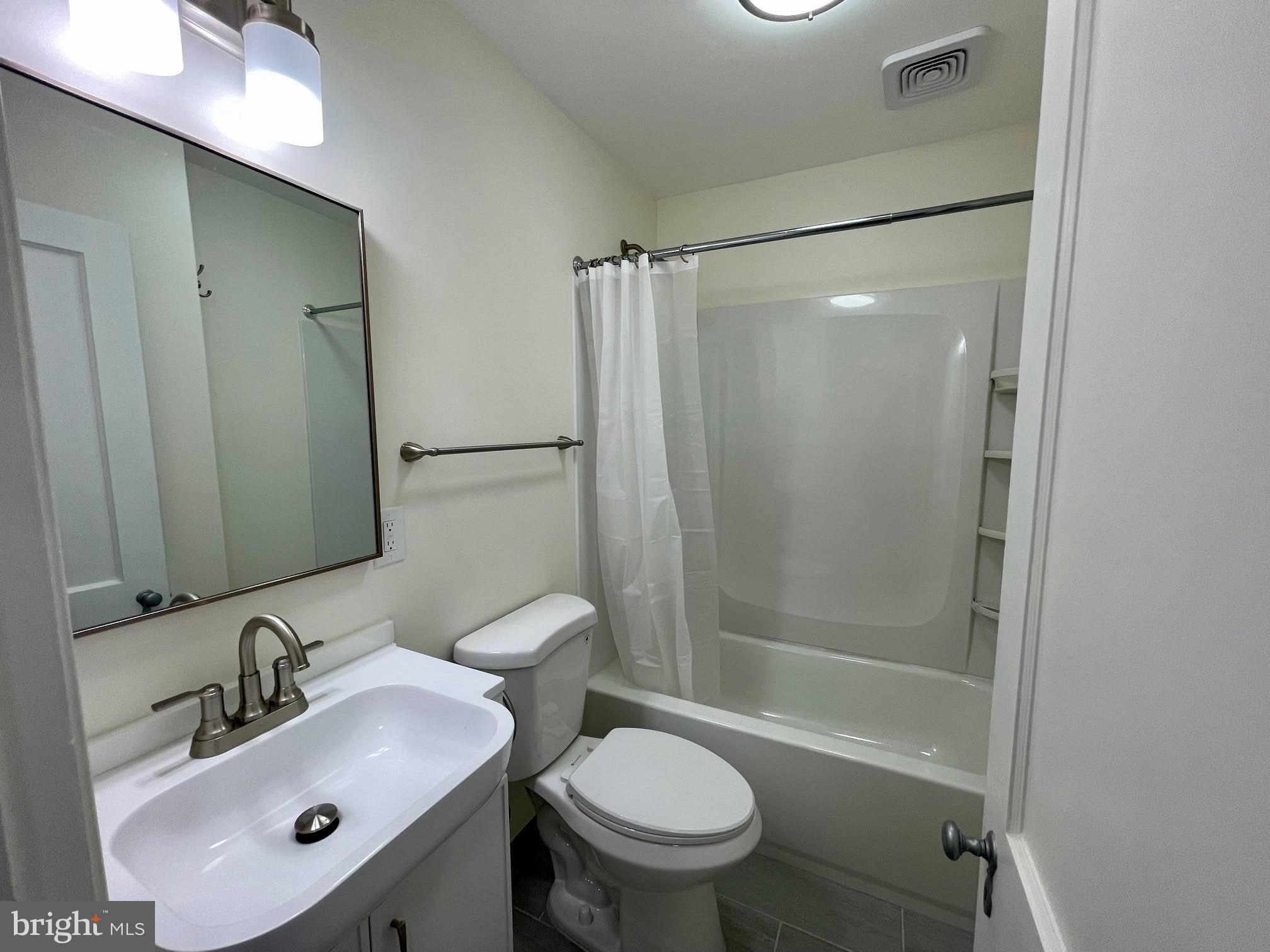416 East Providence Road Aldan, PA 19018 - Photo 7 of 12 a bathroom with a sink toilet and shower