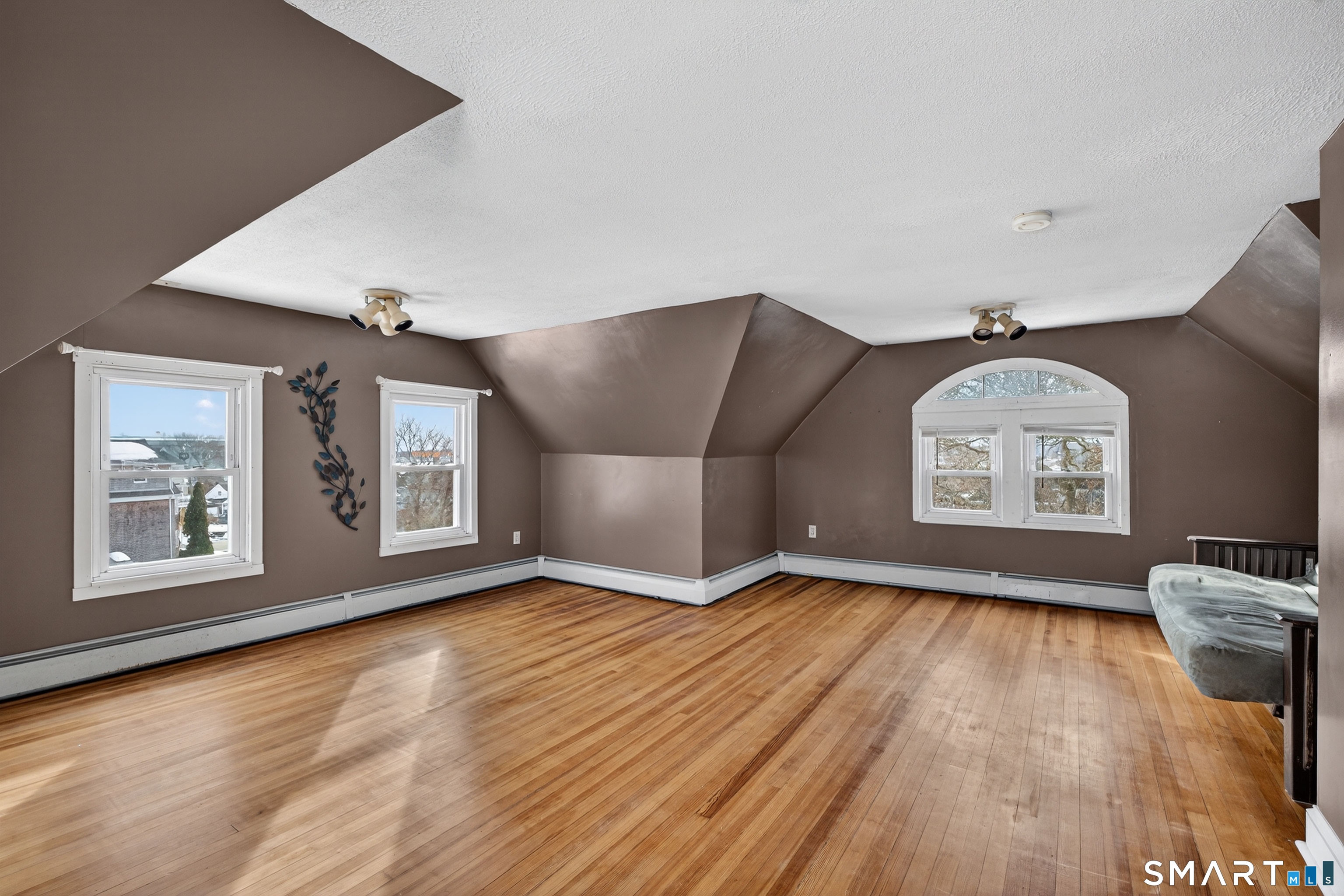 85 Baker Avenue Groton, CT 06340 - Photo 33 of 36 Third floor bonus room finished with hardwood floors