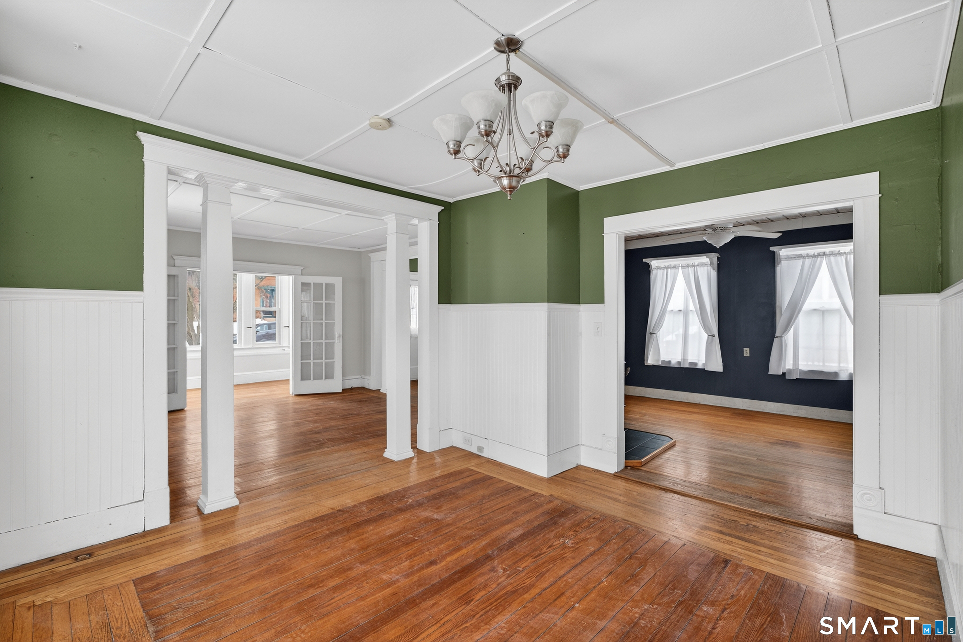 85 Baker Avenue Groton, CT 06340 - Photo 6 of 36 Hardwood floors and decorative beams between rooms. Gorgeous paint colors throughout.