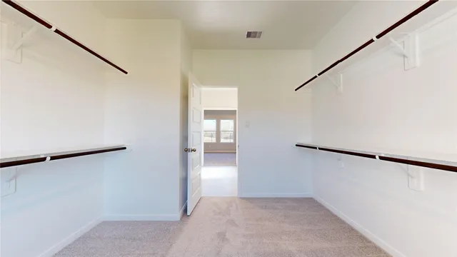 a view of a room with a wardrobe space