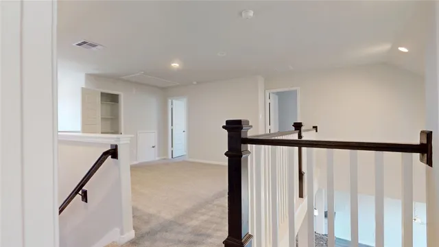 a view of a hallway with a furniture