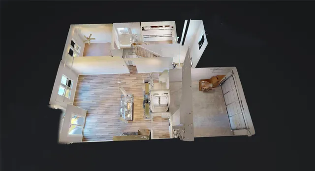 a view of kitchen with kitchen island wooden floor center island and stainless steel appliances