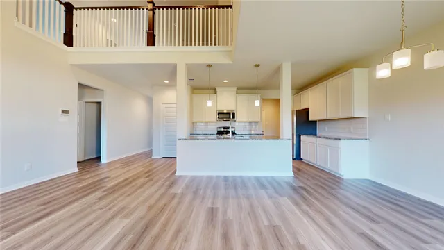a view of a kitchen with wooden floor