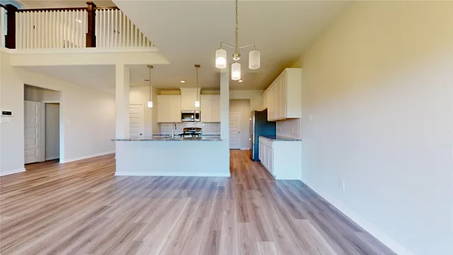 a view of an entryway and wooden floor