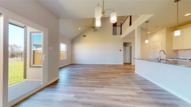 a view of a kitchen from the hallway