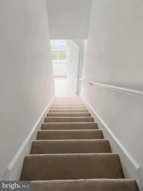 203 Brunswick Road Stephens City, VA 22655 - Photo 9 of 9 Inviting staircase leading to bright entryway.