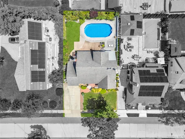 a aerial view of multi story residential apartment building with yard