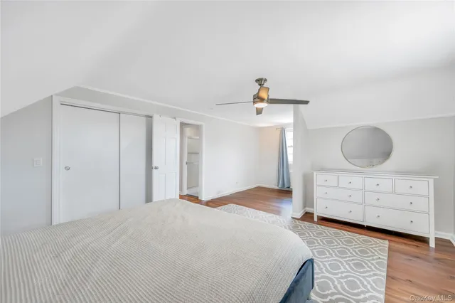 a bedroom with a bed and cabinets