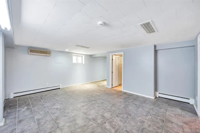 a view of an empty room and a windows