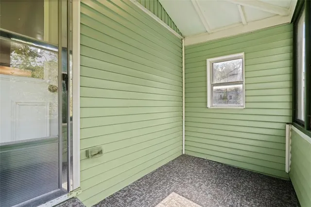 a view of a door and a window