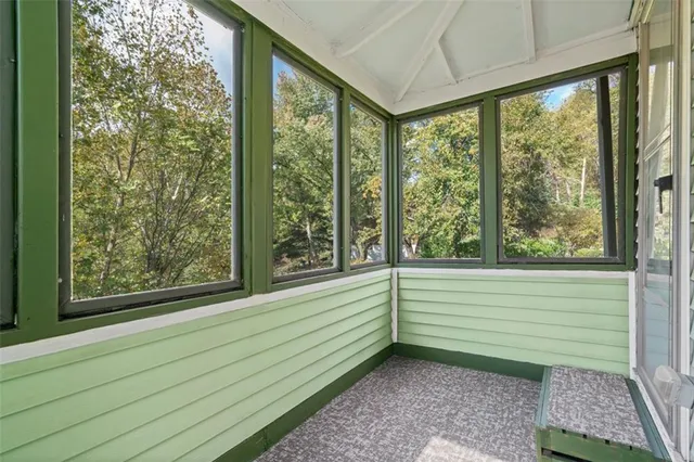 a view of a room with windows and pool