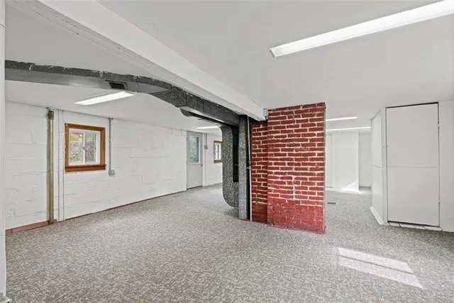 a view of an empty room with a garage