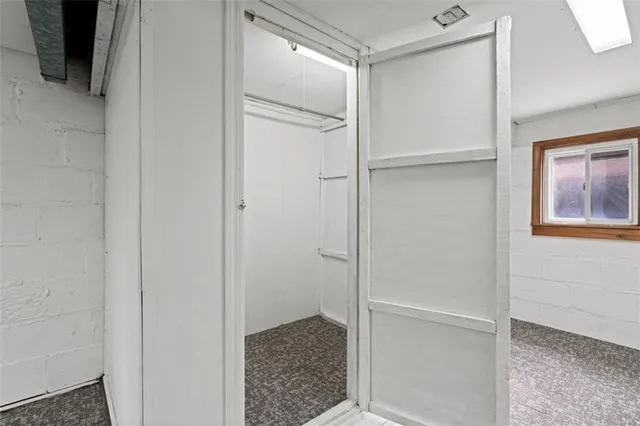 a bathroom with a glass shower door