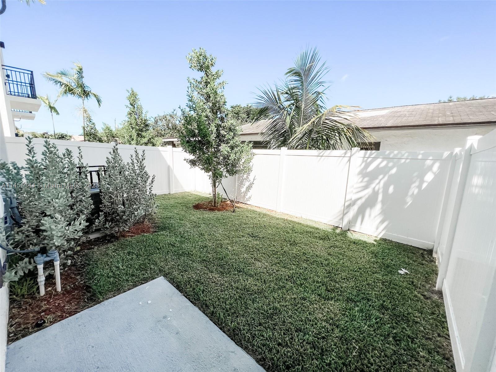 Collier City Pompano Beach, FL 33069 - Photo 26 of 28 a view of a yard in front of a house