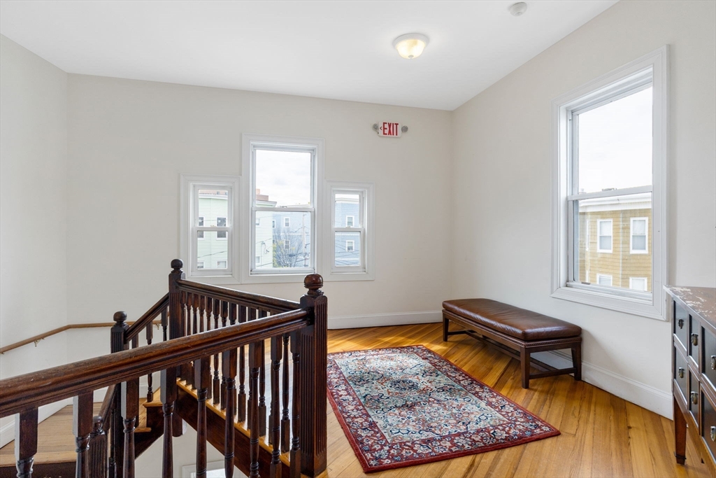 51 Dimick Street, Unit 5 Somerville, MA 02143 - Photo 11 of 28 a bed room with furniture and a window