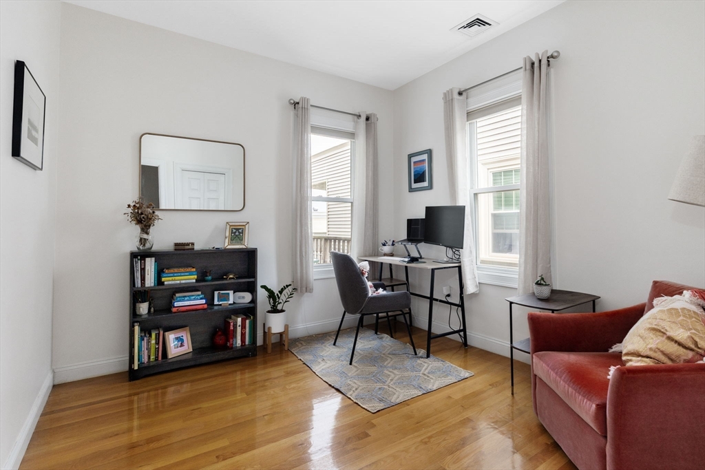 51 Dimick Street, Unit 5 Somerville, MA 02143 - Photo 21 of 28 a view of a livingroom with workspace and a window