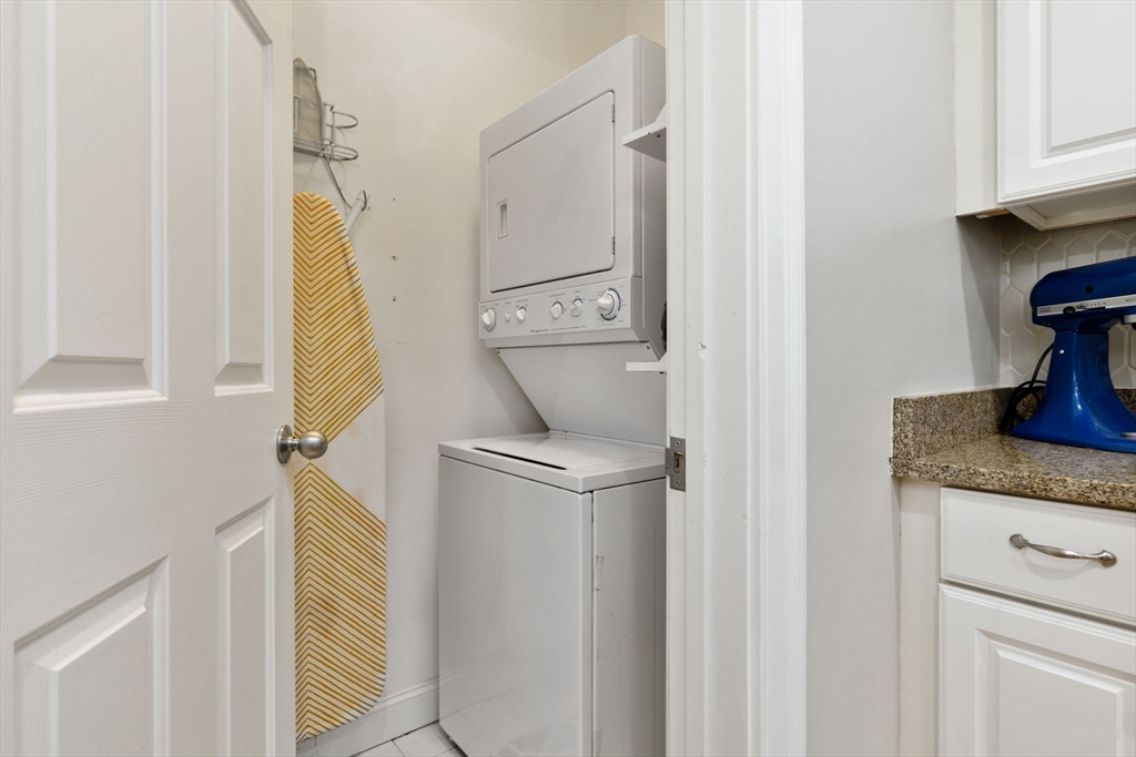 51 Dimick Street, Unit 5 Somerville, MA 02143 - Photo 23 of 28 a view of a kitchen from a hallway
