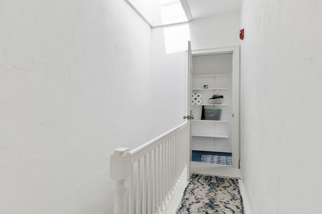 51 Dimick Street, Unit 5 Somerville, MA 02143 - Photo 25 of 28 a bathroom with a bathtub and shower