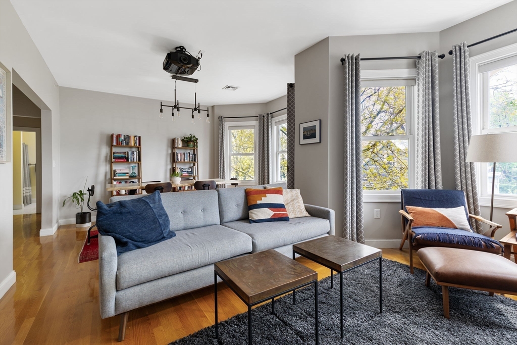 51 Dimick Street, Unit 5 Somerville, MA 02143 - Photo 3 of 28 a living room with furniture and a large window