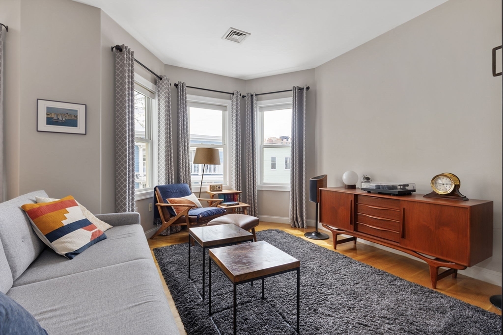 51 Dimick Street, Unit 5 Somerville, MA 02143 - Photo 4 of 28 a living room with furniture and a window