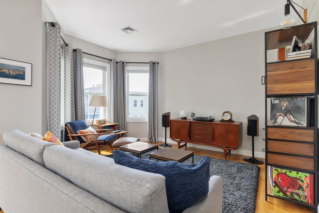 51 Dimick Street, Unit 5 Somerville, MA 02143 - Photo 5 of 28 a living room with furniture and a window