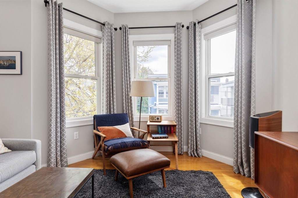 51 Dimick Street, Unit 5 Somerville, MA 02143 - Photo 6 of 28 a living room with furniture and a window