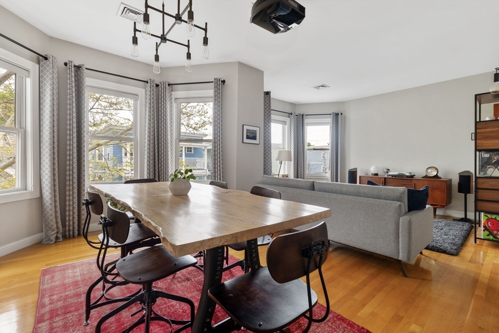 51 Dimick Street, Unit 5 Somerville, MA 02143 - Photo 7 of 28 a view of a dining room with furniture window and wooden floor