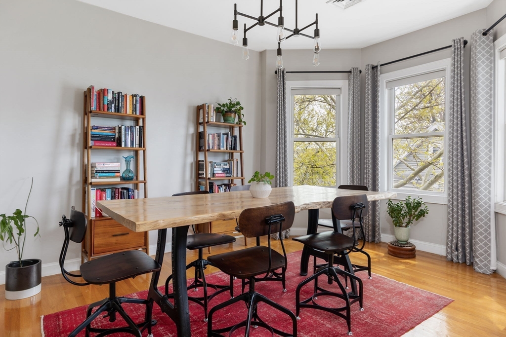 51 Dimick Street, Unit 5 Somerville, MA 02143 - Photo 8 of 28 a view of a dining room with furniture window and wooden floor