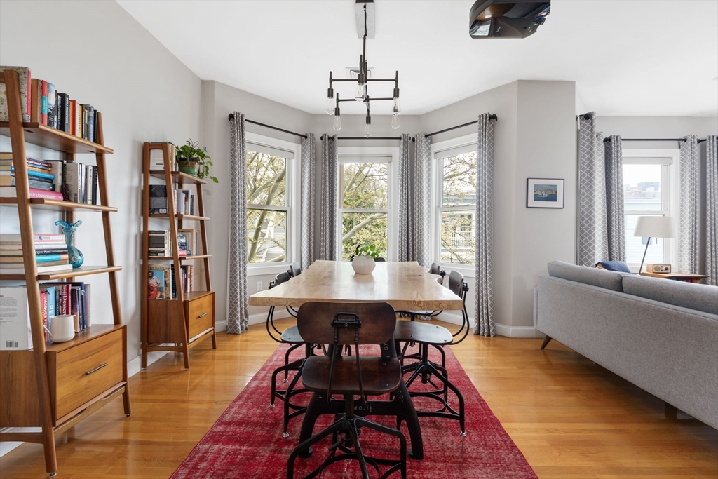 51 Dimick Street, Unit 5 Somerville, MA 02143 - Photo 9 of 28 a view of a dining room with furniture window and wooden floor