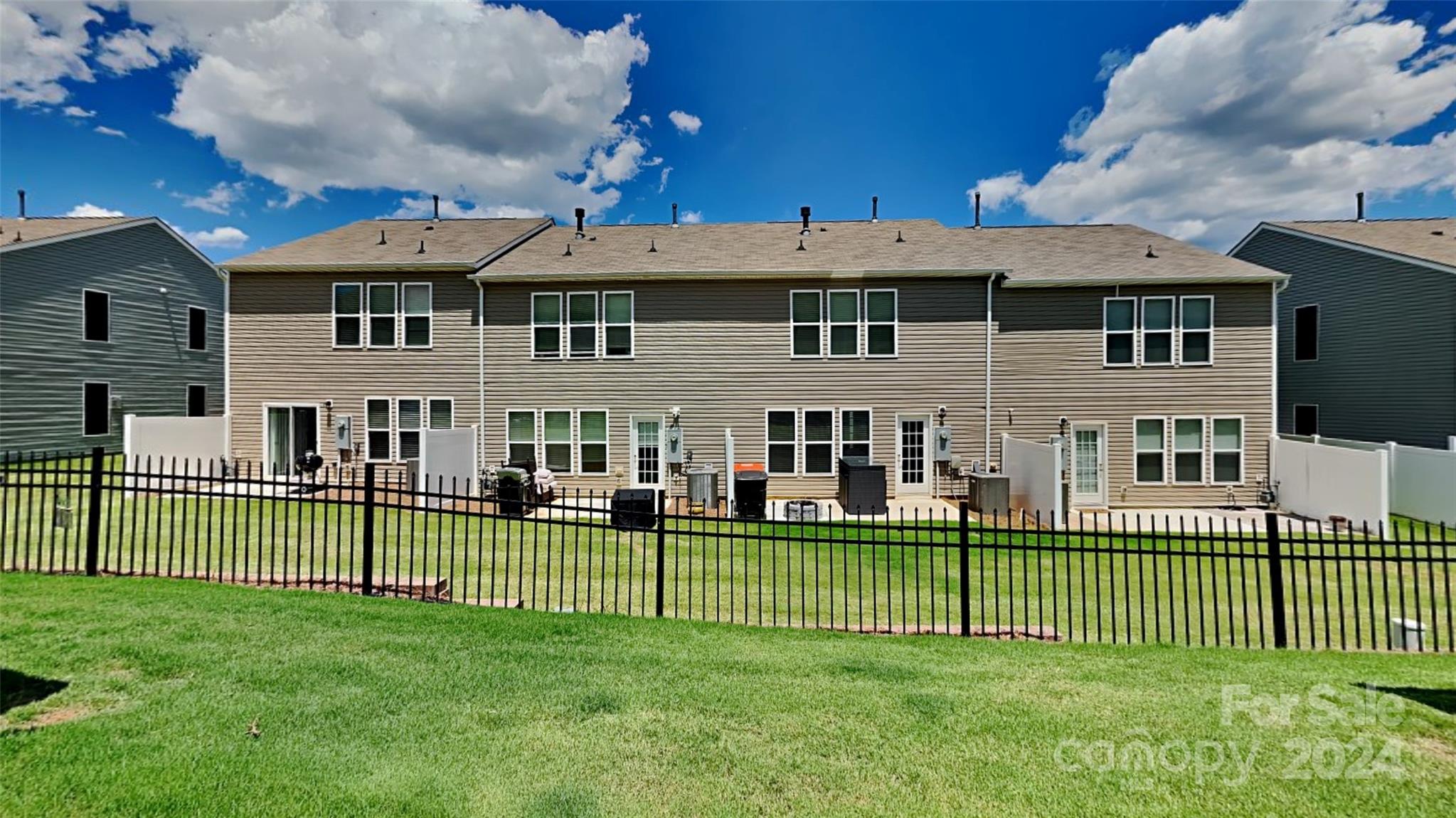 814 Canoe Song Road Fort Mill, SC 29708 - Photo 20 of 20 a view of a house with a backyard