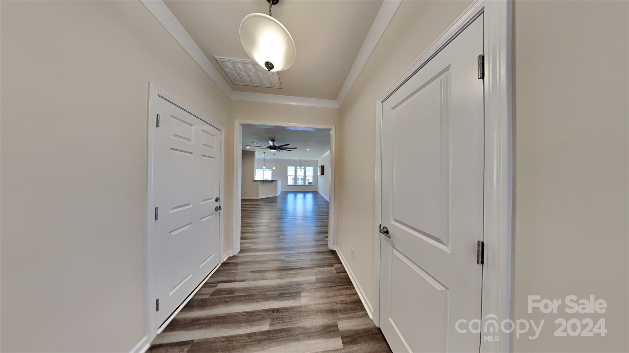814 Canoe Song Road Fort Mill, SC 29708 - Photo 2 of 20 a view of a hallway with wooden floor and staircase