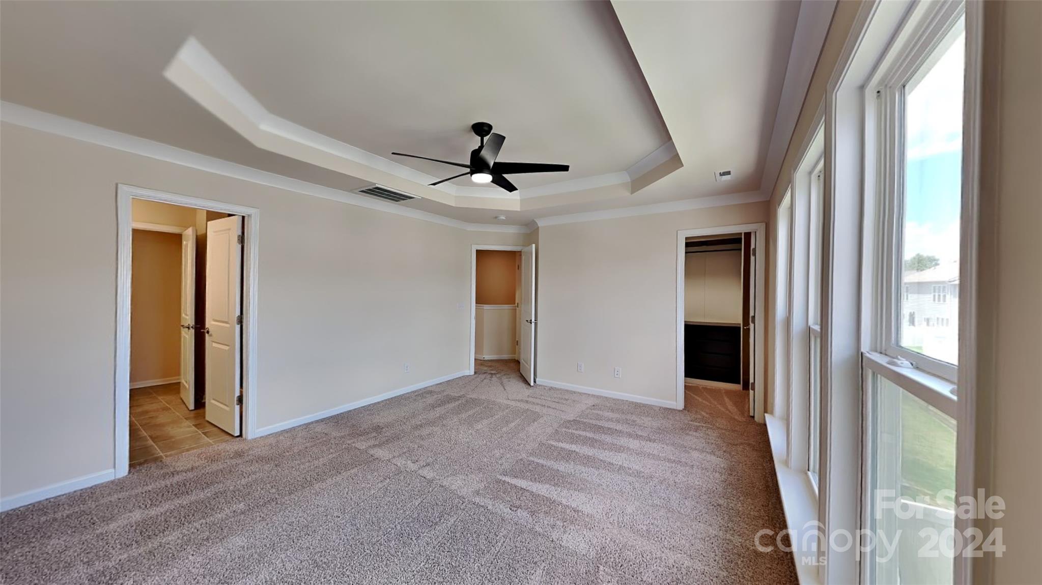 814 Canoe Song Road Fort Mill, SC 29708 - Photo 8 of 20 a view of an empty room and a ceiling fan
